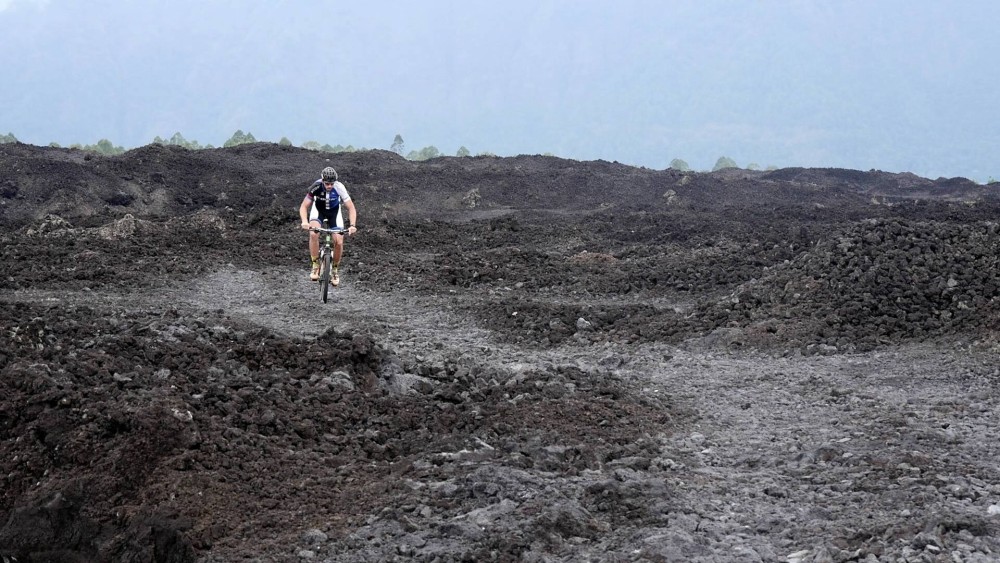 Cycling on the volcanic rocks of Mt Batur.